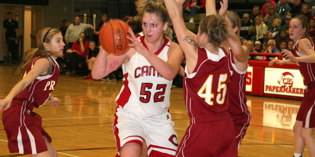 Jenka Stiasna (52) is surrounded by Prairie Falcons Saturday, at Camas High School.