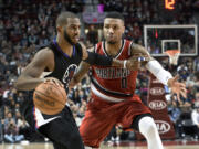 Los Angeles Clippers guard Chris Paul (3) tries to get past Portland Trail Blazers guard Damian Lillard during the second half of an NBA basketball game in Portland, Ore., Wednesday, Jan. 6, 2016. The Clippers won 109-98.