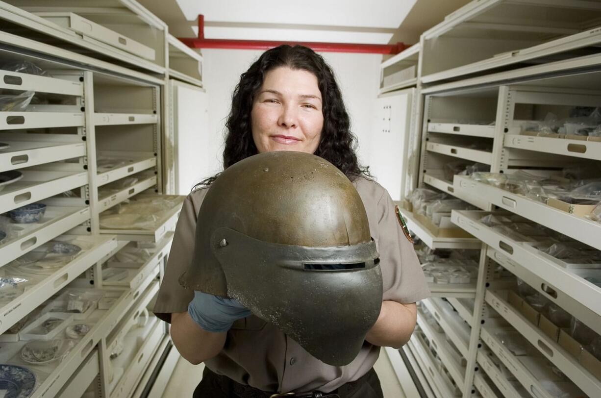 National Park Service employee Heidi Pierson holds a 1918 U.S.