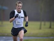 Jon Marcus, 28, led the annual Vancouver Lake Half Marathon from start to finish on Sunday, winning in 1:09:38.