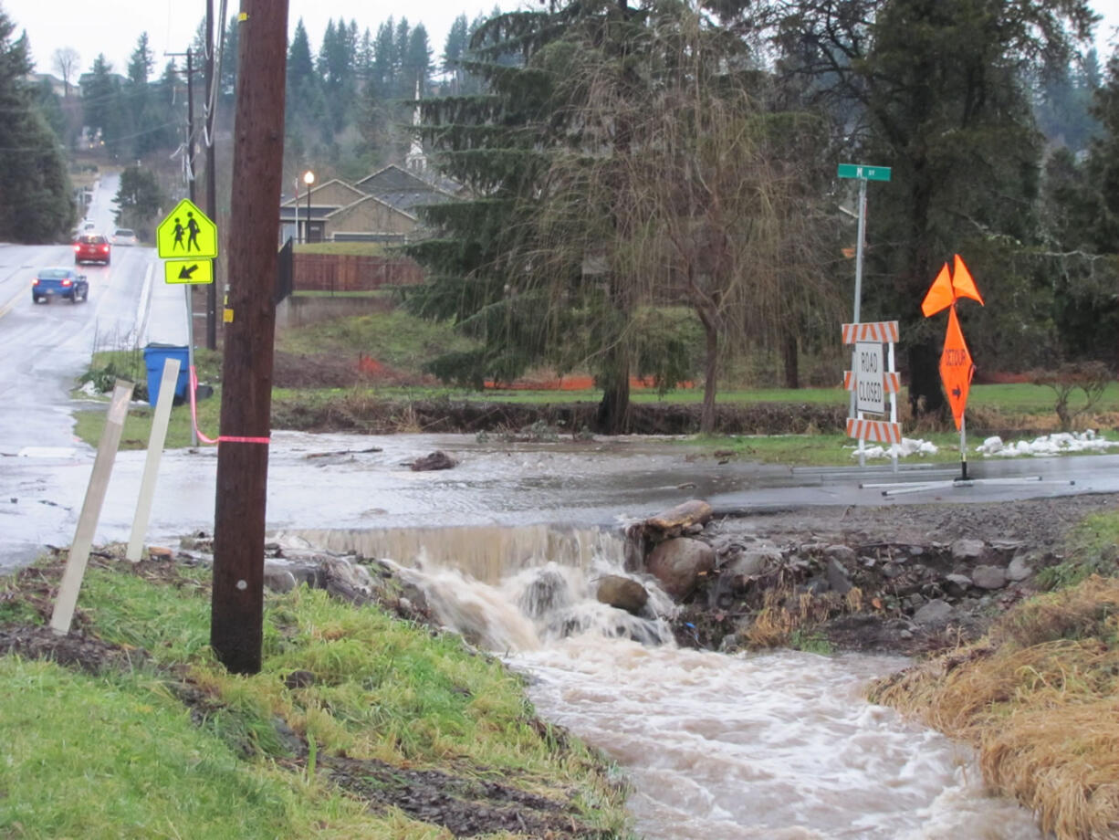 Water rushed across M Street, at 39th Street, from culvert to culvert, on Thursday following rainfall that totalled approximately 3 inches.