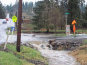 Water rushed across M Street, at 39th Street, from culvert to culvert, on Thursday following rainfall that totalled approximately 3 inches.