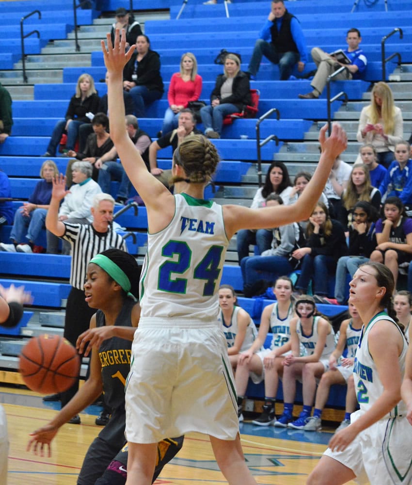 Evergreen&#039;s Ahna Burney (1) collides with Mountain View&#039;s Hailey Hartney during the second quarter of a high school girls basketball game Wednesday.