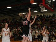 Jenka Stiasna puts the ball in the basket for Camas in the district championship game against Prairie Friday, at Fort Vancouver High School.