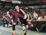 Washougal sophomore Erin Locke sets Lakewood's Allison Lawton up for a rough landing Friday, during the 2A state wrestling tournament at the Tacoma Dome.