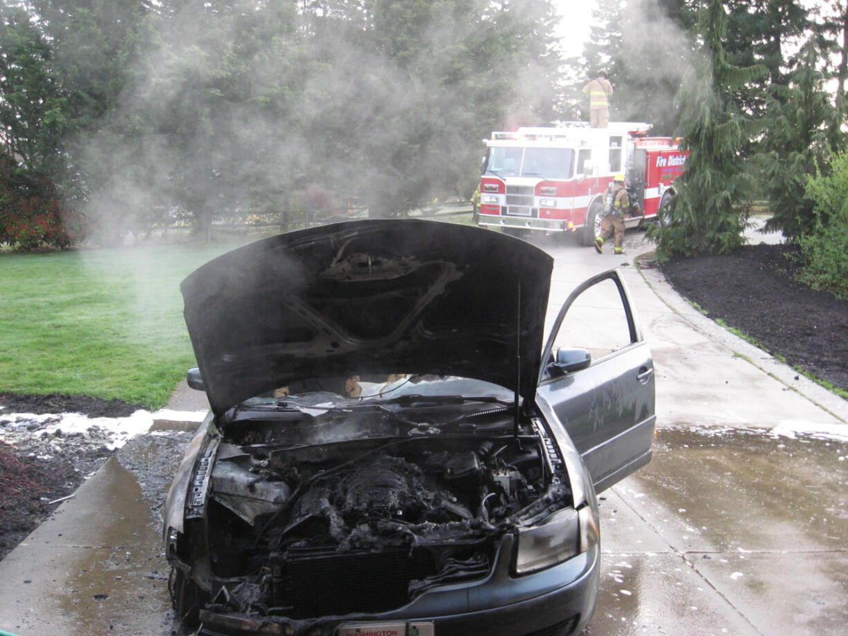 Firefighters with Clark County Fire District 3 doused a car fire in Brush Prairie Tuesday morning.