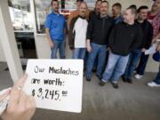 About 20 Clark County Sheriff's deputies gathered to get their moustaches sheared for charity at Bernie and Rollie's Barber Shop in 2010 for the American Cancer Society.