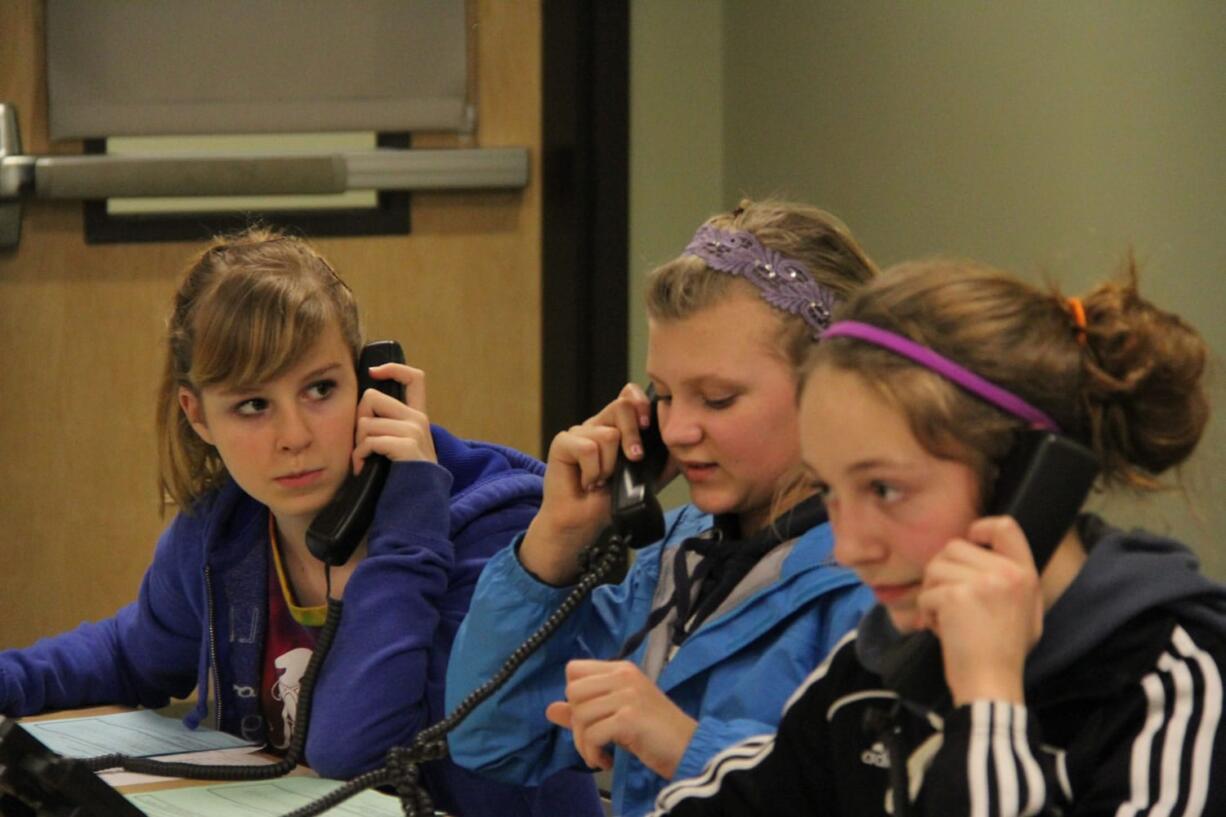 Student volunteers phone patrons in the Camas School District seeking pledges to support the local grant programs.