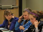 Student volunteers phone patrons in the Camas School District seeking pledges to support the local grant programs.