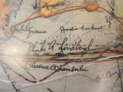 Signatures of aviators Charles Lindbergh and Amelia Earhart highlight a replica of an American Geographical Society explorers' and fliers' globe.