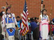 Orchards: Koda Robinson, Head Man Dancer and Alvia Begay, Head Woman Dancer, perform at the Native American Education Program traditional pow-wow at Covington Middle School on March 3.