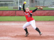 Sarah Nidick winds up a pitch for the Papermakers in the rain Monday, at Camas High School.