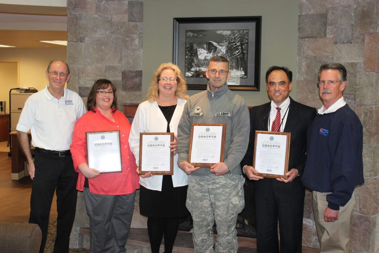 Eagle Rehabilitation at Camas recently made a pledge to support and honor the men and women who are members of the United States military Guard and Reserve.  Representatives from the Employer Support of the Guard and Reserve, a Department of Defense organization, recently visited the local facility to present certificates memorializing this commitment to U.S. troops. The ESGR was established to promote cooperation and understanding between Reserve members and their civilian employers and to assist in the resolution of conflicts arising from an employee's military commitment.  Pictured above are (left to right)  Camas resident Art McCallum, ESGR ombudsman; Sheri Boles, occupational therapist at Eagle Rehabilitation; Diane Backstrom, Eagle Rehabilitation director of nursing; Col. Daniel R. Kern, Washington National Guard; Paul McVay, Eagle Rehabilitation administrator; and Joel F. Scott, ESGR area chair for the Washington Committee.