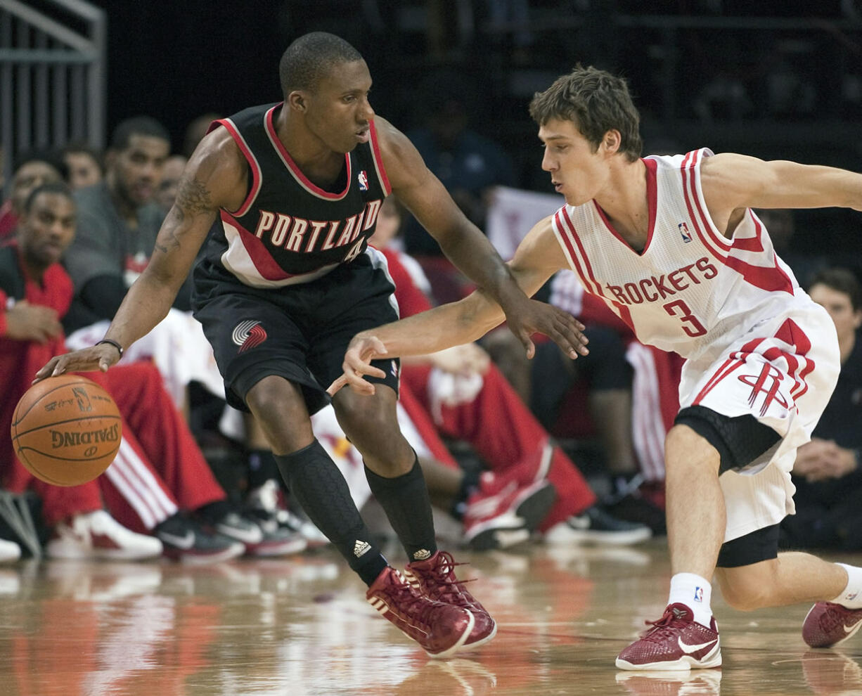 Portland rookie guard Nolan Smith, here being guarded by Houston's Goran Dragic (3), has strong support at home in sister Sydney.