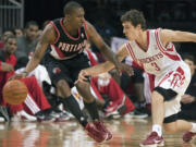 Portland rookie guard Nolan Smith, here being guarded by Houston's Goran Dragic (3), has strong support at home in sister Sydney.