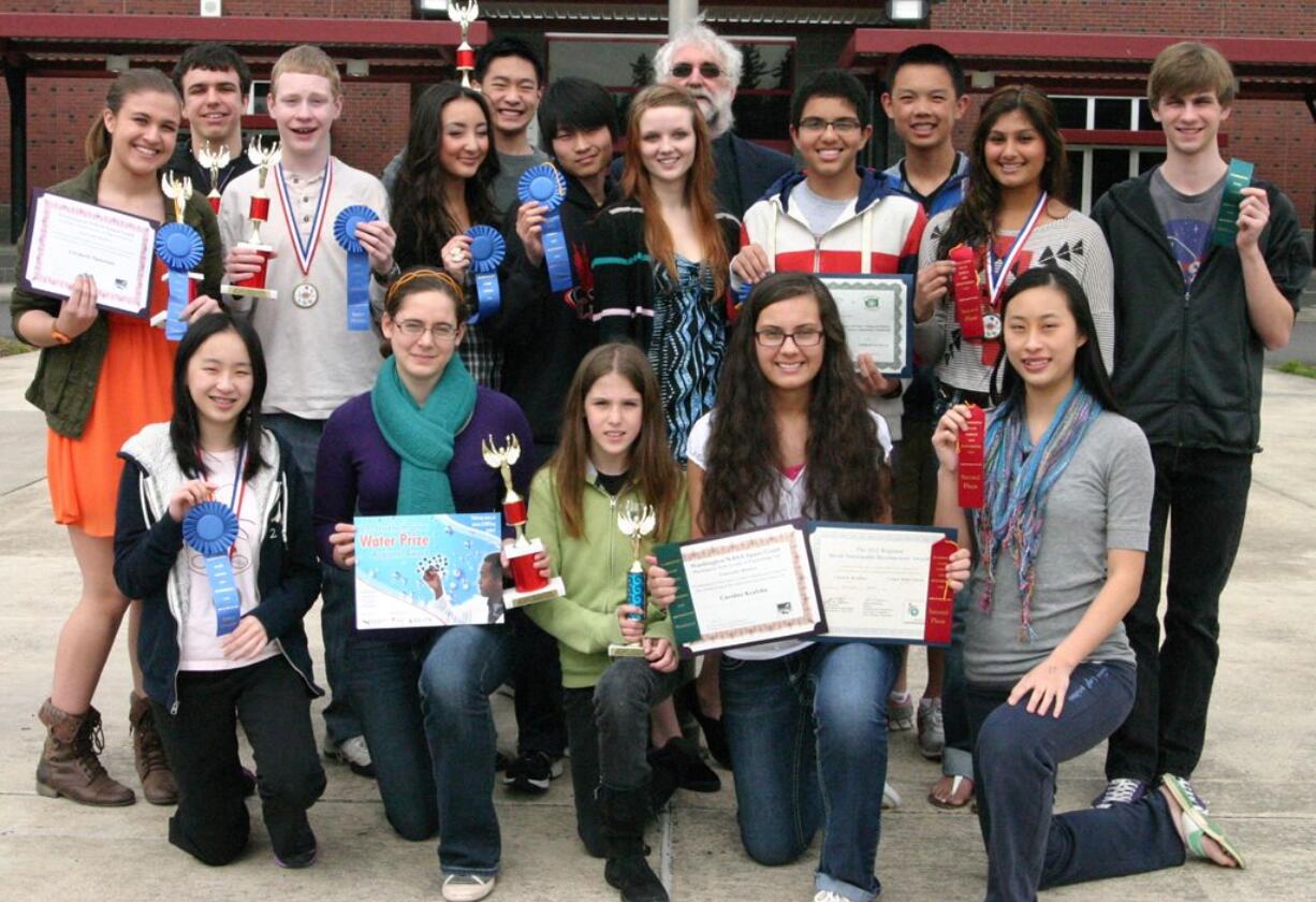 Camas High School students had a good showing at the recent Washington State Science and Engineering Fair finals. They include (bottom row, kneeling left to right) Yushuan Peng, Sophie Shoemaker, fifth-grader Emily Sheppard, Caroline Kealoha and Joanna Liao.; (top row, left to right) Elizabeth Nickerson, Aaron Deml, Kyle Binder, Camille Ritter, Jonathan Liao, Rachel Fadlovich, advisor Ron Wright, Reesab Pathak, Jonathan Ho, Meghal Sheth and Jackson Merle.