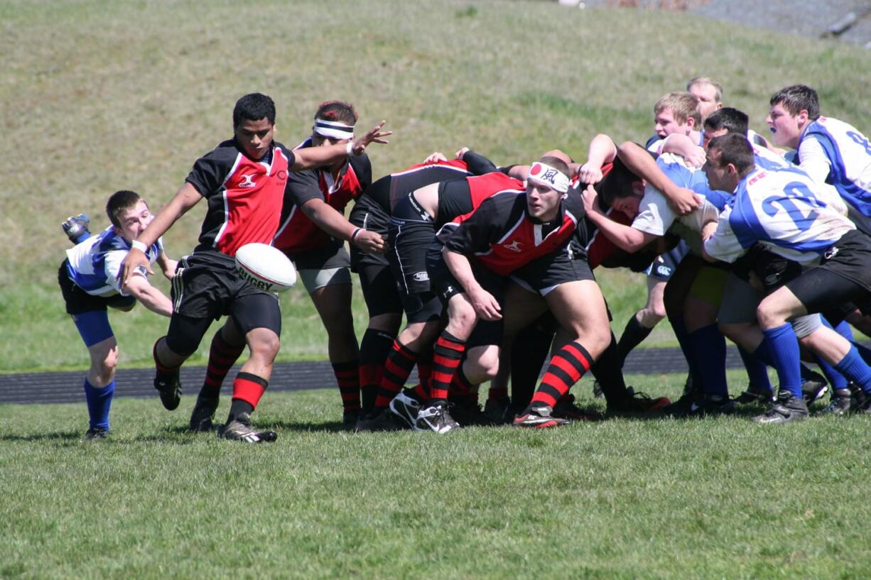 Jesse Saulo gets the kick off just in time for the Camas Rugby team Saturday, at Skyridge Middle School.