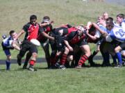 Jesse Saulo gets the kick off just in time for the Camas Rugby team Saturday, at Skyridge Middle School.