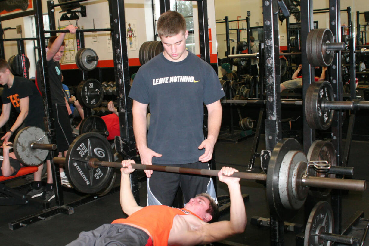 Jarrett Gregory lends a helping hand to Bobby Jacobs.