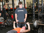 Jarrett Gregory lends a helping hand to Bobby Jacobs.