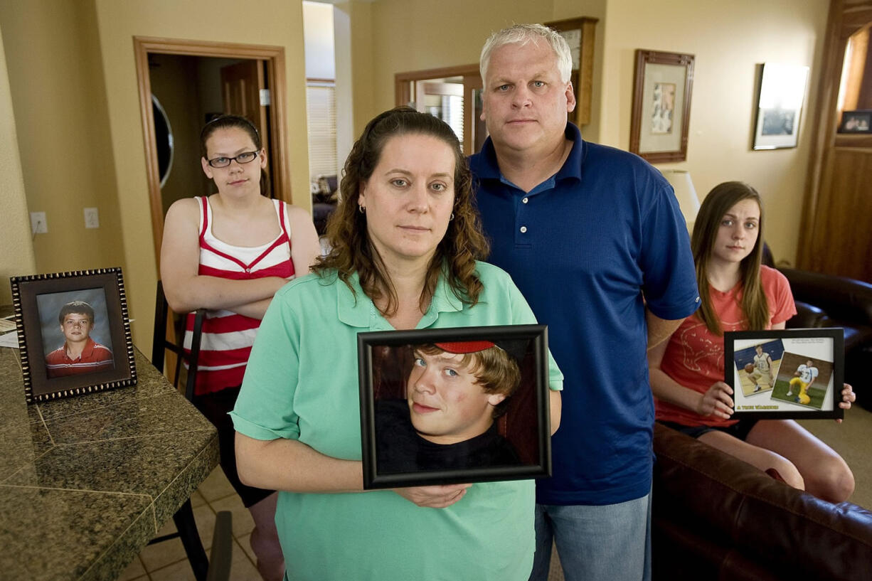 Scott Driscoll, center right, and his family experienced the death of son Quinn, 13, on June 10, 2009, of cardiac arrest. The two-year-old Quinn Driscoll Foundation has raised thousands of dollars to purchase AEDs for the Vancouver and Evergreen school districts and has provided screenings for hundreds of athletes. Scott Driscoll died Friday, Aug.