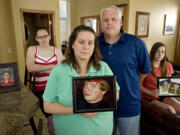 Scott Driscoll, center right, and his family experienced the death of son Quinn, 13, on June 10, 2009, of cardiac arrest. The two-year-old Quinn Driscoll Foundation has raised thousands of dollars to purchase AEDs for the Vancouver and Evergreen school districts and has provided screenings for hundreds of athletes. Scott Driscoll died Friday, Aug.