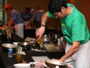 Peter Echevario, reigning Camas Iron Chef for the past two years, is back to defend his title in this year's cooking competition, which raises money for local schools.