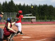 Mikaela Searight crushes the softball over the left field fence for a 2-run home run.