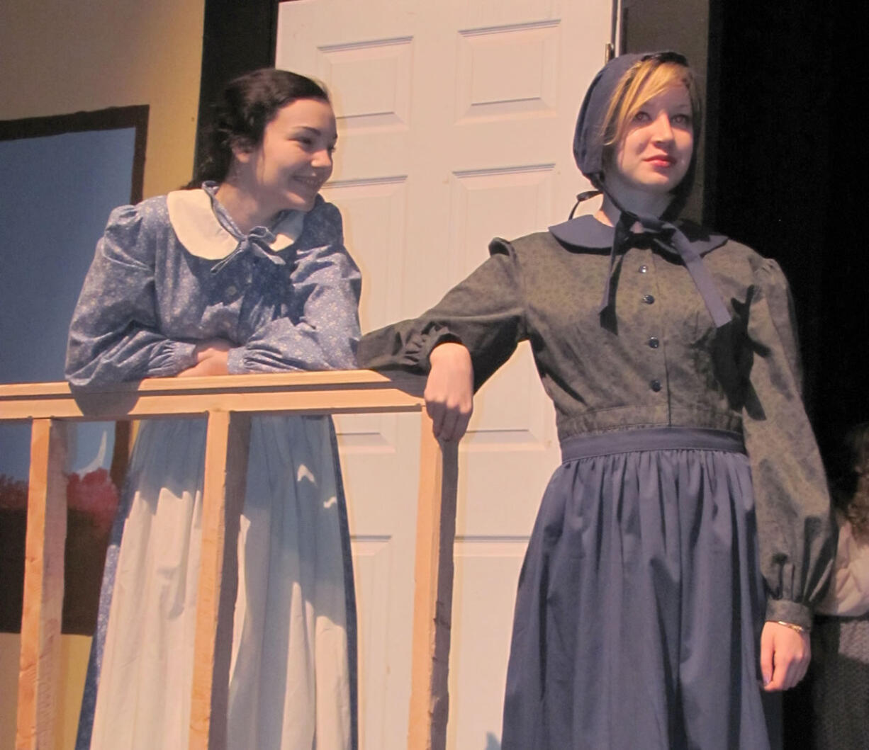 At right, Sarah Vonham (Robyn Pfeifer) shares a story with her daughter (Zoe West).