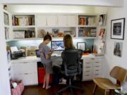 Arley Sakai, 9, talks to his mother, Wanda Weller-Sakai in her office at the family's home in Ojai, California, on March 2, 2012. The home is a 1970's ranch house recently remodeled in a modern style.