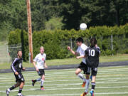 Roldan Alcobendas wins the battle in the air for the soccer ball Saturday, at Doc Harris Stadium.