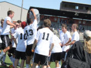 The Washougal boys soccer players celebrate their first trip to the 2A state championship tournament since 2001.