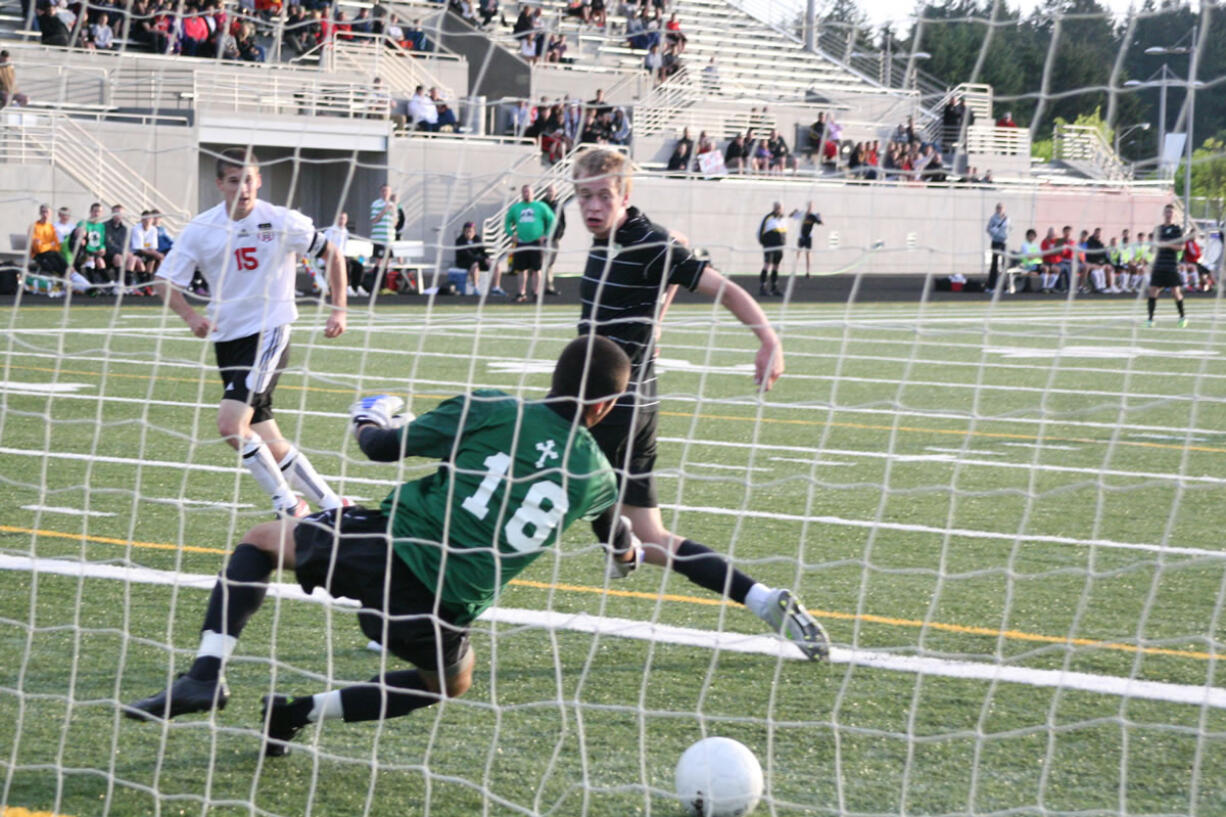 Camas senior Adam Allison outwits the goalkeeper with a header into the back of the net Wednesday, at Doc Harris Stadium. The Papermakers defeated Bishop Blanchet 1-0 in the first round of the state tournament. Camas (16-2) faces Mountain View in the quarterfinals Saturday, at Doc Harris.