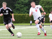 Drew White (8) and the Camas High School boys soccer team delivered two  exciting victories in front of home crowds at Doc Harris Stadium to return to the final four.