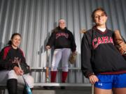 Camas seniors, from left, Mikaela Searight, Sarah Nidick and Cali Mulholland patrol the middle of the field for the Camas softball team.