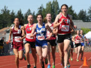 Camas runners Austen Reiter (left) and Camille Parsons (right) feed off each other in the 3A girls 1,600-meter state championship race Saturday, at Mt.