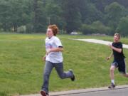 Battle Ground: Justin Fletcher is in the lead with Kyle Peterson on his tail at the Relay for Life walk/run at Tukes Valley Middle School.