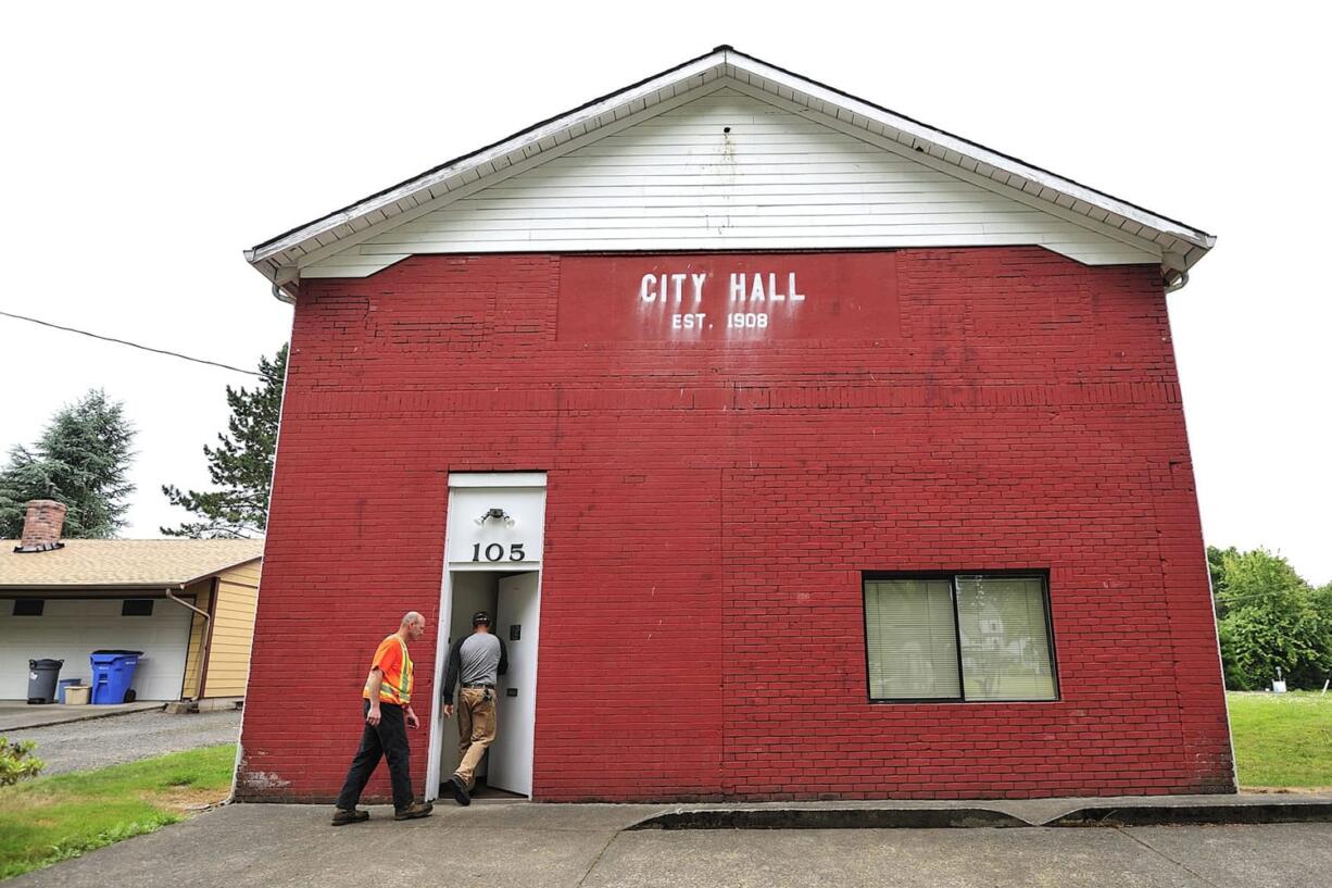 Municipal workers head into the former Yacolt town hall that will provide space for an &quot;express&quot; library.