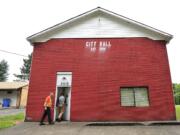 Municipal workers head into the former Yacolt town hall that will provide space for an &quot;express&quot; library.