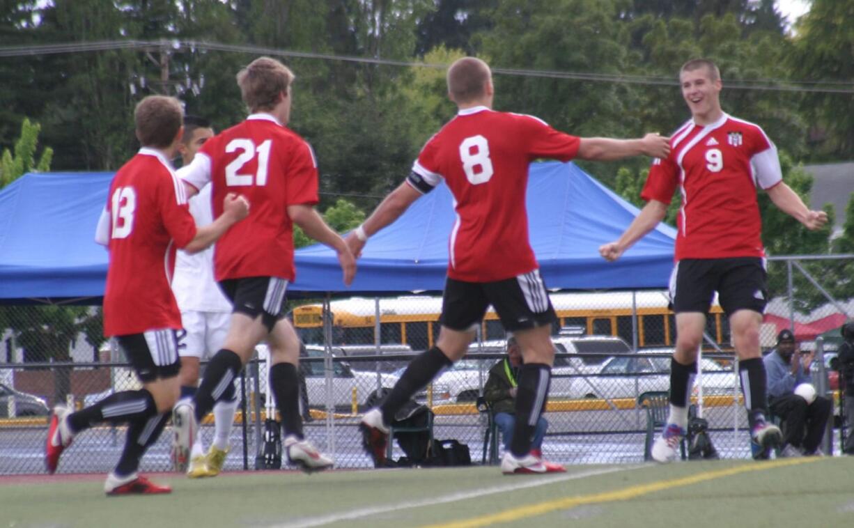 Parker Roland, Nate Beasley, Drew White and Adam Allison (inset, left to right) celebrate the first of seven goals for the Camas boys soccer team in the final four.