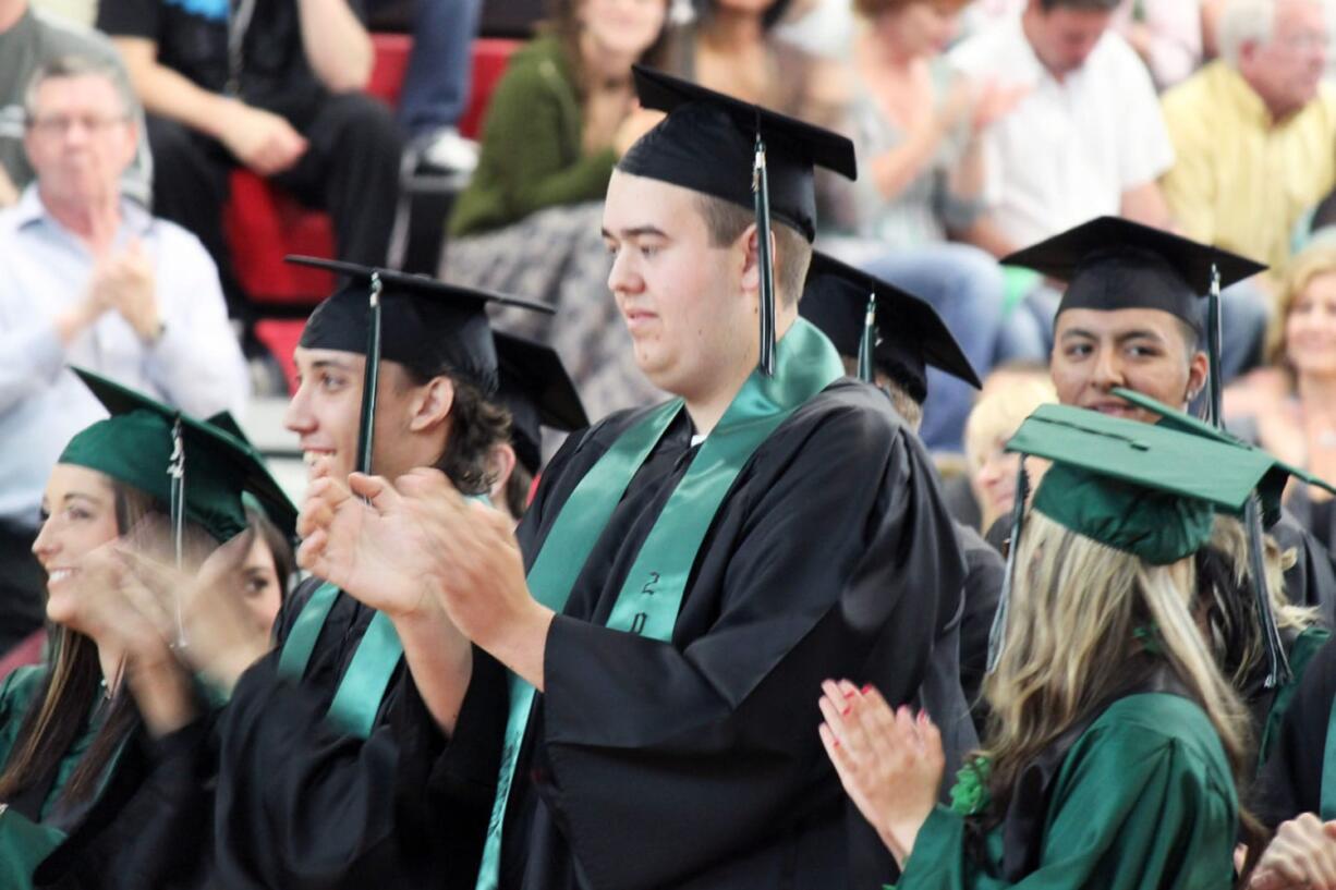 Hayes Freedom graduates Corina Morgan, Andrew Jacobson, Tanner Wehring, Franciso Ponce and Samantha Thomas (left to right) celebrate following the presentation of the diplomas on Saturday.