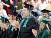 Hayes Freedom graduates Corina Morgan, Andrew Jacobson, Tanner Wehring, Franciso Ponce and Samantha Thomas (left to right) celebrate following the presentation of the diplomas on Saturday.