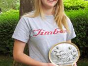 Heather Deuhlen proudly holds her Vancouver United Soccer Alliance Player of the Year award.