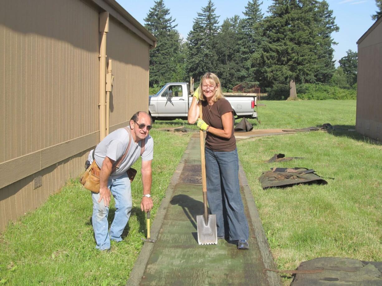 New Washougal School District Superintendent Dawn Tarzian spent a recent afternoon with maintenance department members Bob Widner (pictured) and Al Seaman, making improvements to Jemtegaard Middle School.