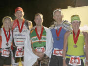 Lacamas Headhunters Lori and Jason Saunders (left), Stephan Shoemaker (center) and his parents John and Suzi Shoemaker (right) finished the 2011 Ironman Canada.