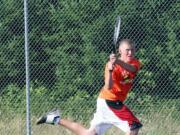 Regan Townsend backhands the ball for Washougal Friday, on the Camas tennis court.