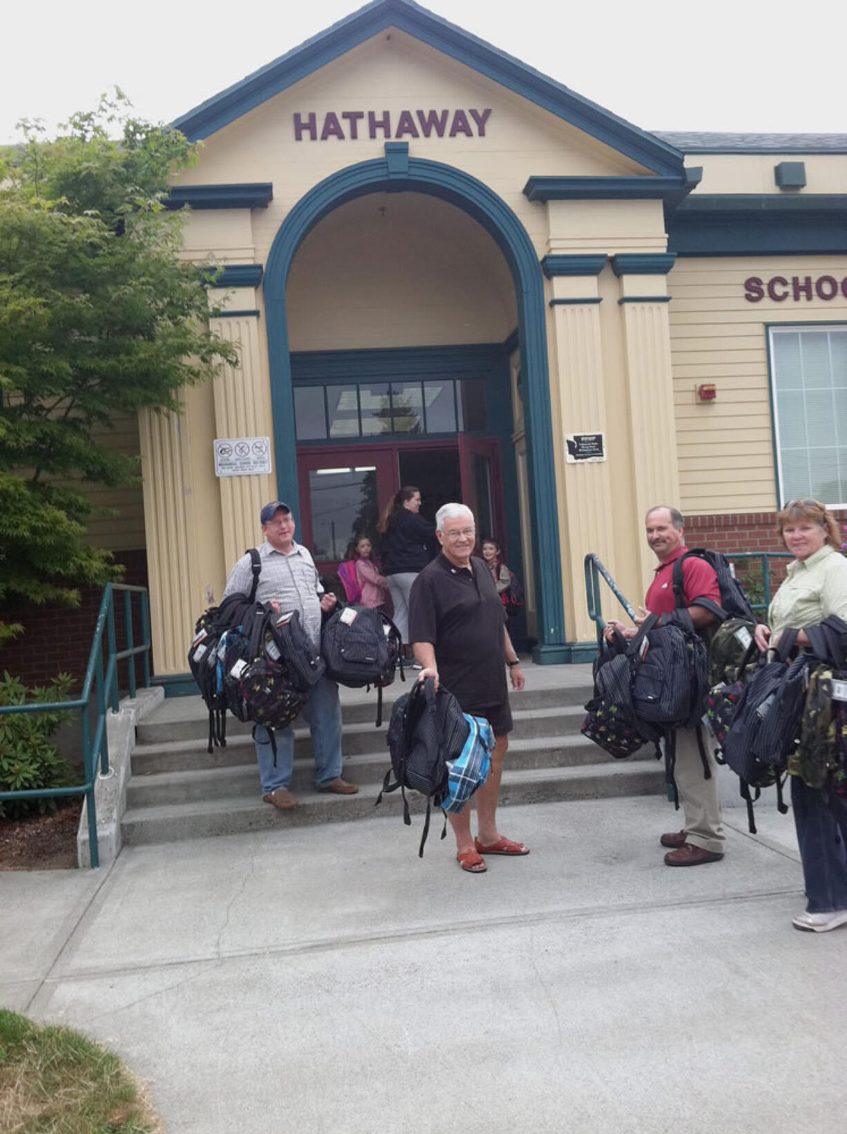 Members of the Camas-Washougal Rotary Club spent time distributing backpacks to children in need at area schools recently.