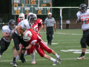 Stephen Camden escapes a trap set by Fort Vancouver Friday, at Kiggins Bowl.