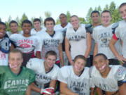 Camas High School football players show of their pink mouthguards, which were designed by Franson Family Dentistry of downtown Camas.