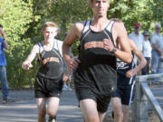 Washougal runners Noah Collins (front) and Geer McGee (left) finished in the top four with Sean Eustis and Isaac Stinchfield Thursday, at Lake Sacajawea Park.